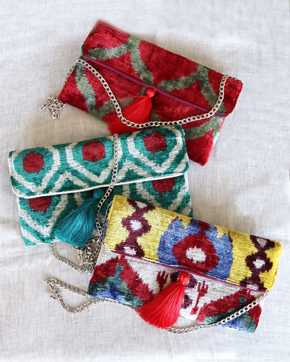 These unique clutch bags are specially crafted using handwoven silk velvet ikat with vibrant colors and ethnic patterns. Each one carries its own uniqueness, accentuated by special handmade details