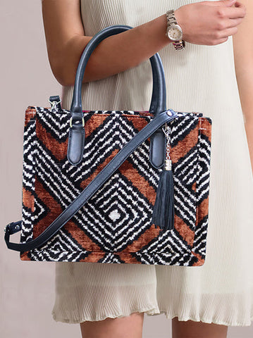 Miaseta,silk Velvet Ikat Medium Tote Bags are crafted with traditional techniques using handwoven ikat weaving, consisting of 75% cocoon silk and 25% organic cotton for durability and a unique design.