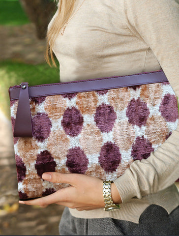 Silk Velvet Ikat Handbags are crafted with traditional techniques using handwoven ikat weaving, consisting of 75% cocoon silk and 25% organic cotton for durability and a unique design