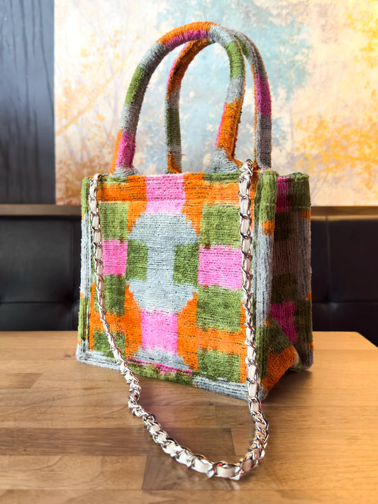 Handmade petite velvet tote bag featuring a traditional ikat pattern in boho style, crafted from soft velvet fabric – perfect as a mini everyday purse or stylish accessory.