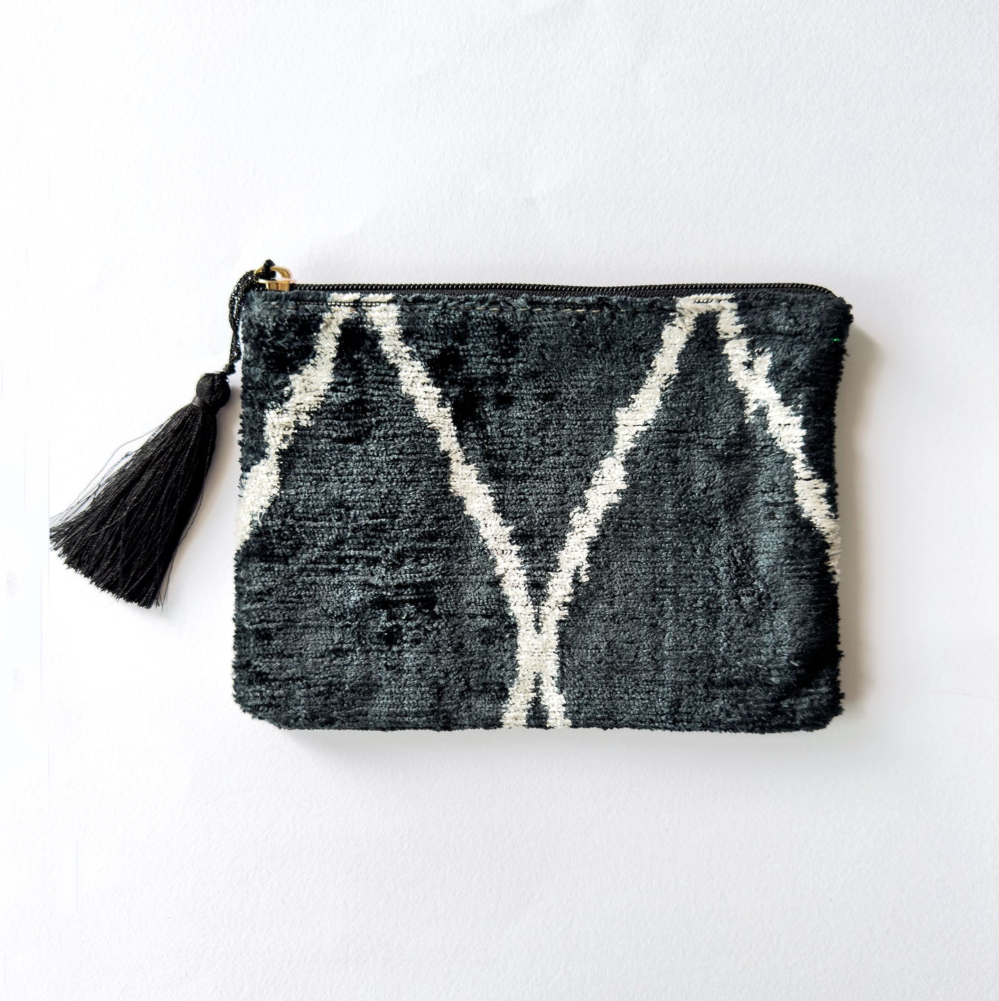 Authentic Ikat Artistry: Hand-loomed Silk Velvet Black with a unique, luxurious pattern.