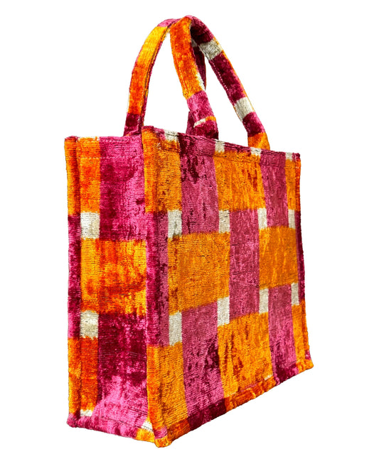 Vibrant Pink and Orange Ikat Velvet Tote Bag with a bold checkered design.