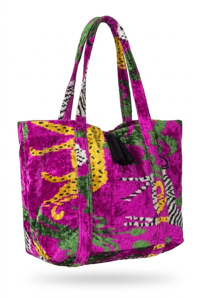 Colorful tote bag with animal print design on a white background. Oversized ikat bag beach summer look