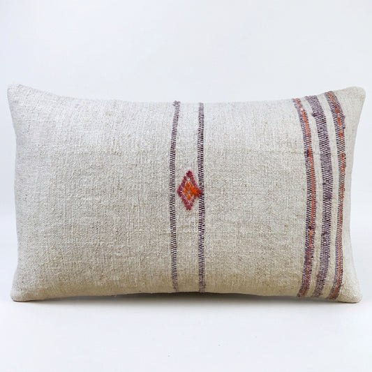 Handcrafted from authentic antique grain sack fabric, this lumbar pillow features soft lavender stripes with a delicate handwoven geometric motif. Its natural linen texture and timeless design bring understated elegance and rustic character to any interior.