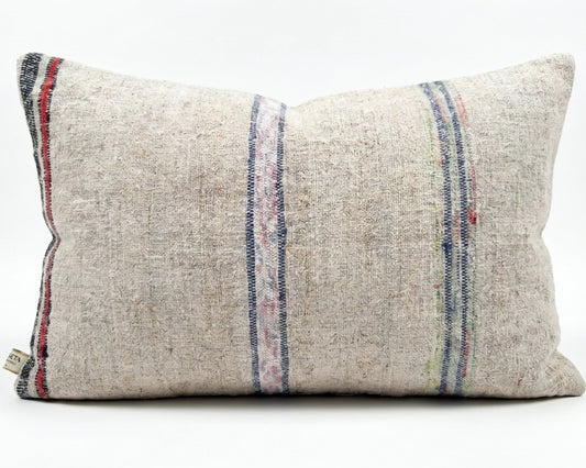 Antique Anatolian grain sack lumbar pillow with faded multi stripe handwoven linen textile