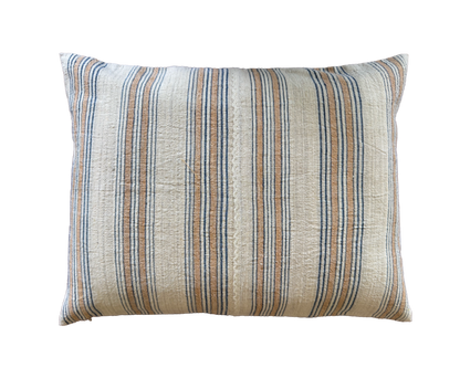 Decorative throw pillow with a linen fabric, featuring vertical stripes in beige, and blue on a solid white background.