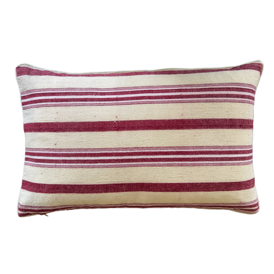 Artisan double-sided silk ikat and antique handwoven linen cushion cover with burgundy ikat pattern.