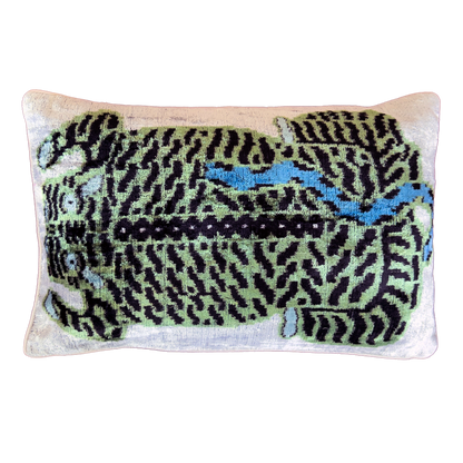 Green leopard silk velvet ikat cushion cover with black and blue details on an ivory velvet background