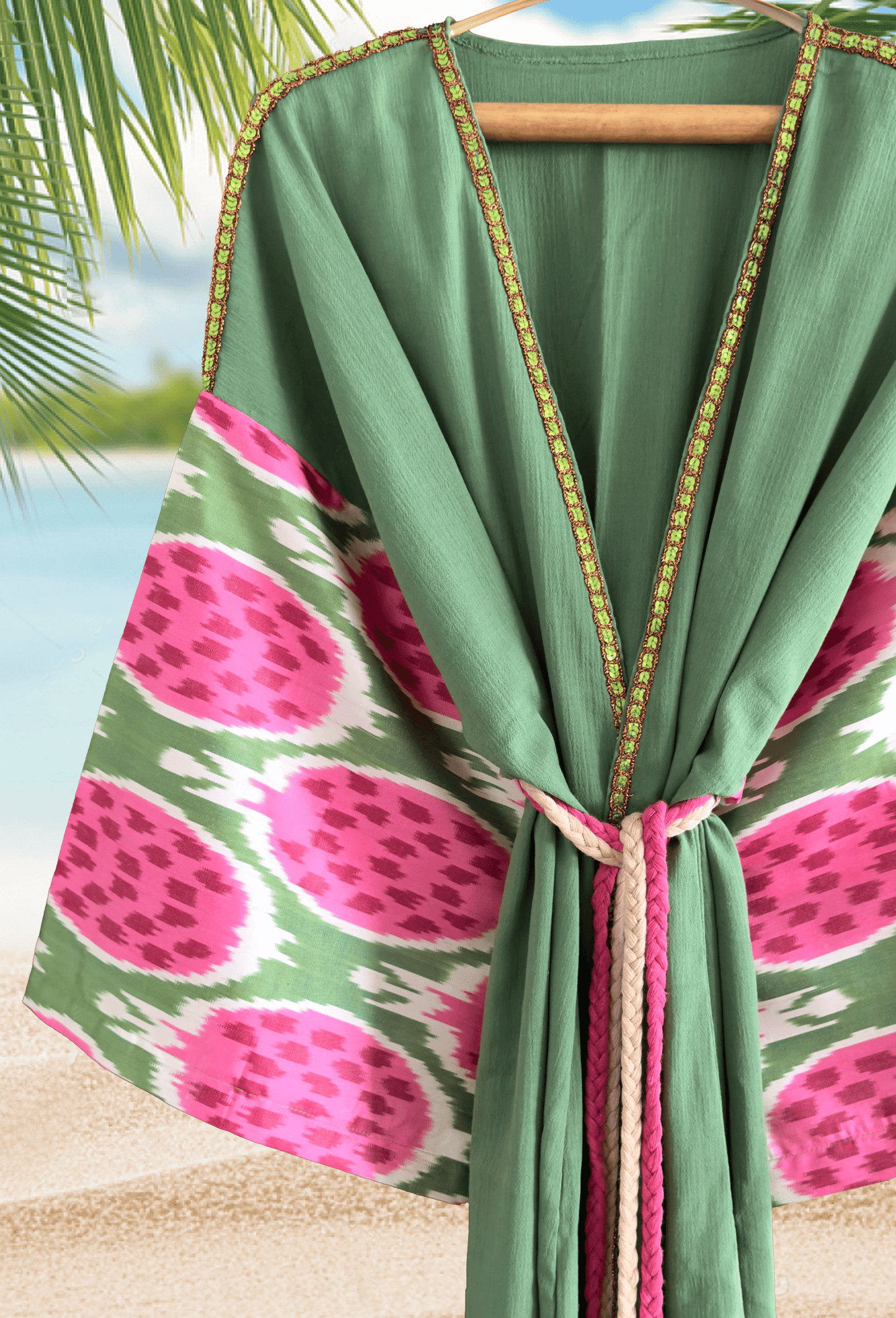 Green muslin kimono robe with pink pomegranate silk ikat sleeves and embroidered border