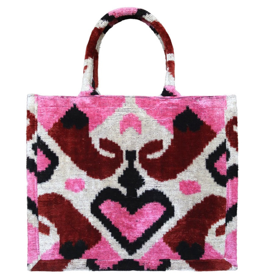 Shop Colorful and Luxurious Tote Bags for Women
Step into a world of vibrant fashion with our collection of luxury tote bags that combine elegance and functionality. Our colorful tote bags feature intricate ikat textile designs, adding a unique cultural flair to your wardrobe. From bold and vibrant velvet totes to timeless canvas tote bags, each piece is meticulously crafted to provide a statement look for any occasion. Looking for the perfect bag to carry your essentials? Choose from our selection of larg