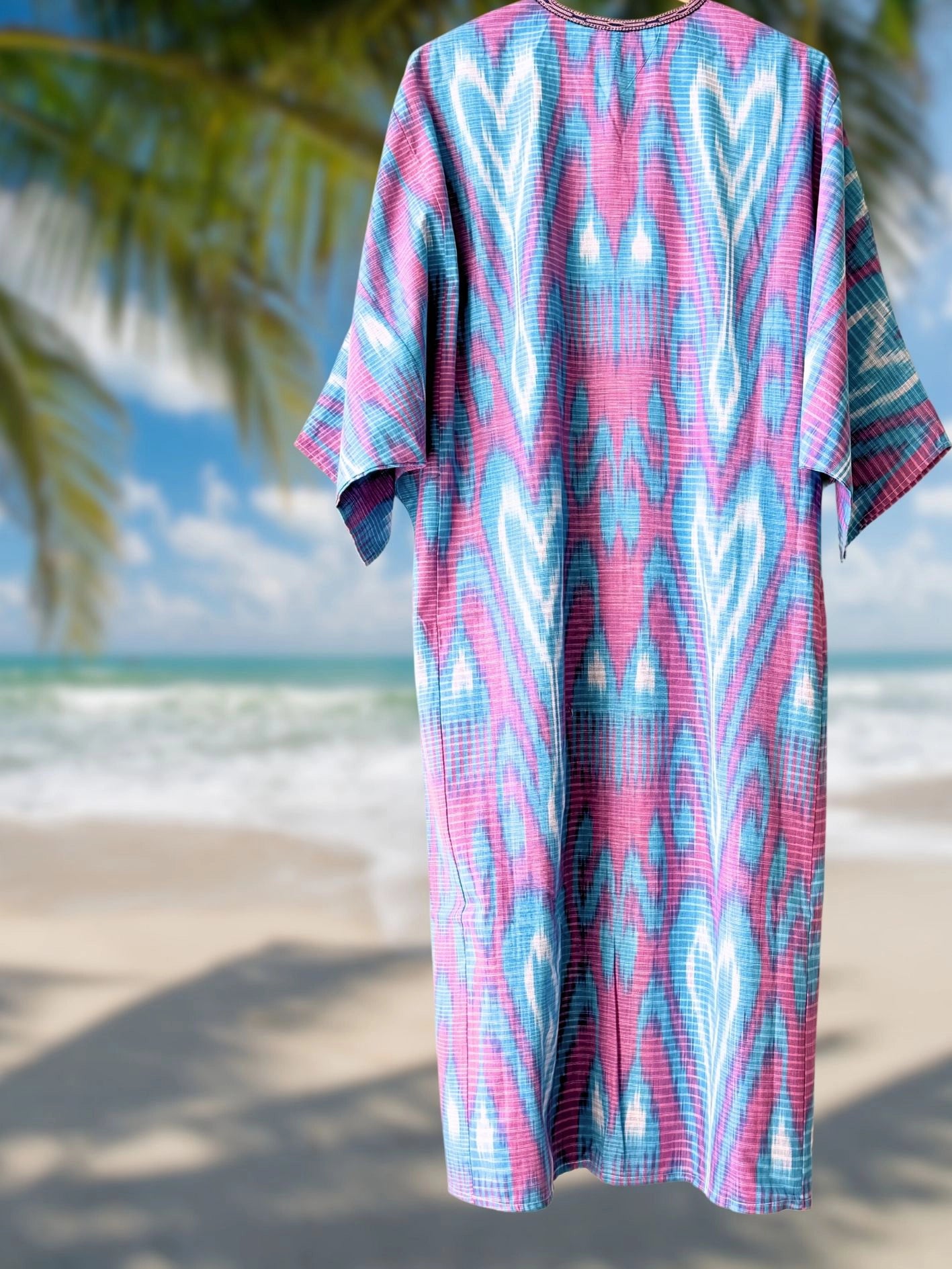Light cotton ikat caftan dress in light blue and pink, one-size fit with authentic handwoven texture.