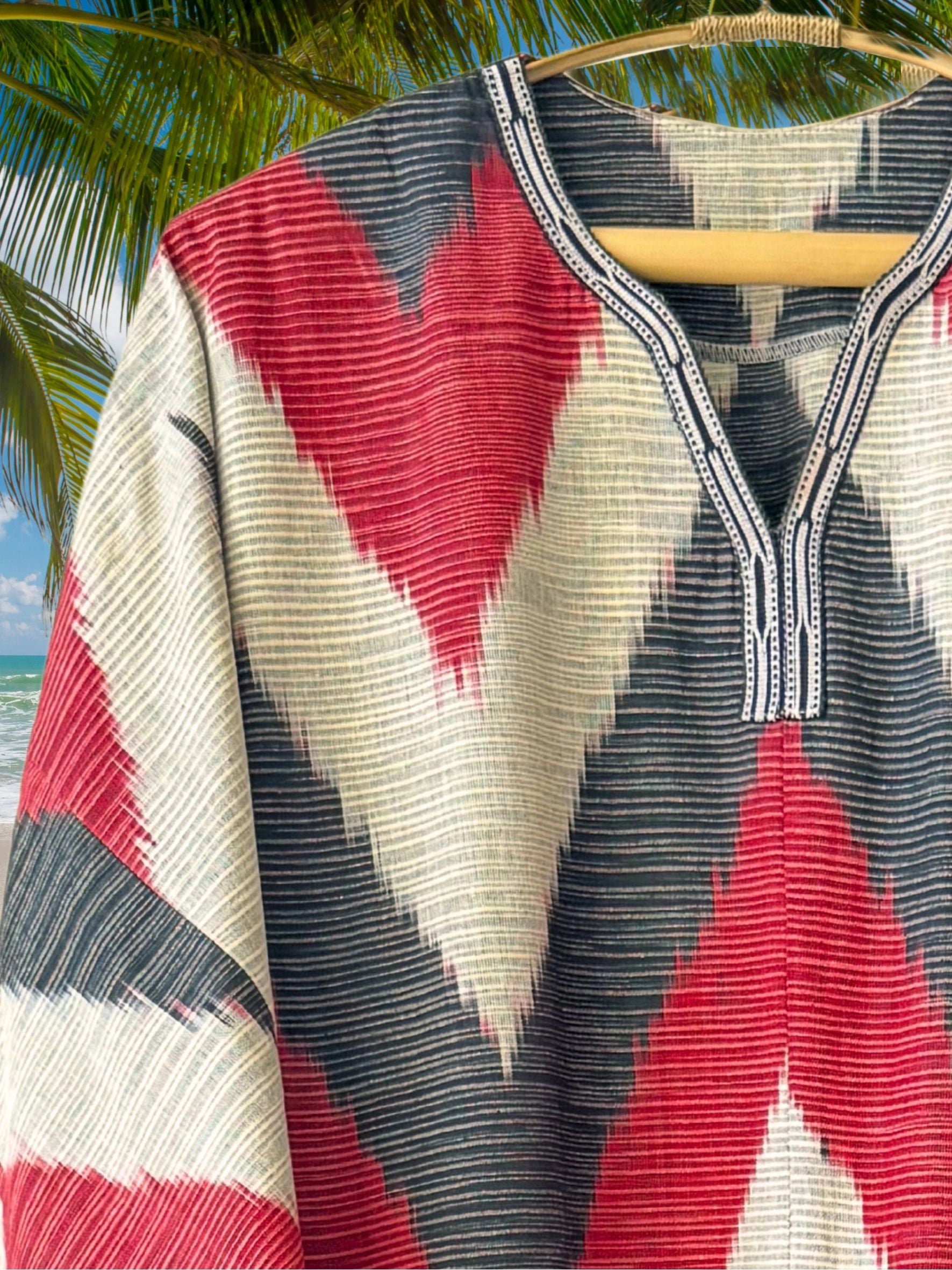 Artisan red and white cotton ikat caftan dress featuring handwoven details and breathable summer fabric.