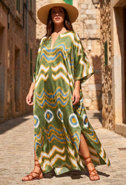 Olive green silk ikat wave caftan with blue and mustard flowing patterns, handwoven artisan kaftan with side slit