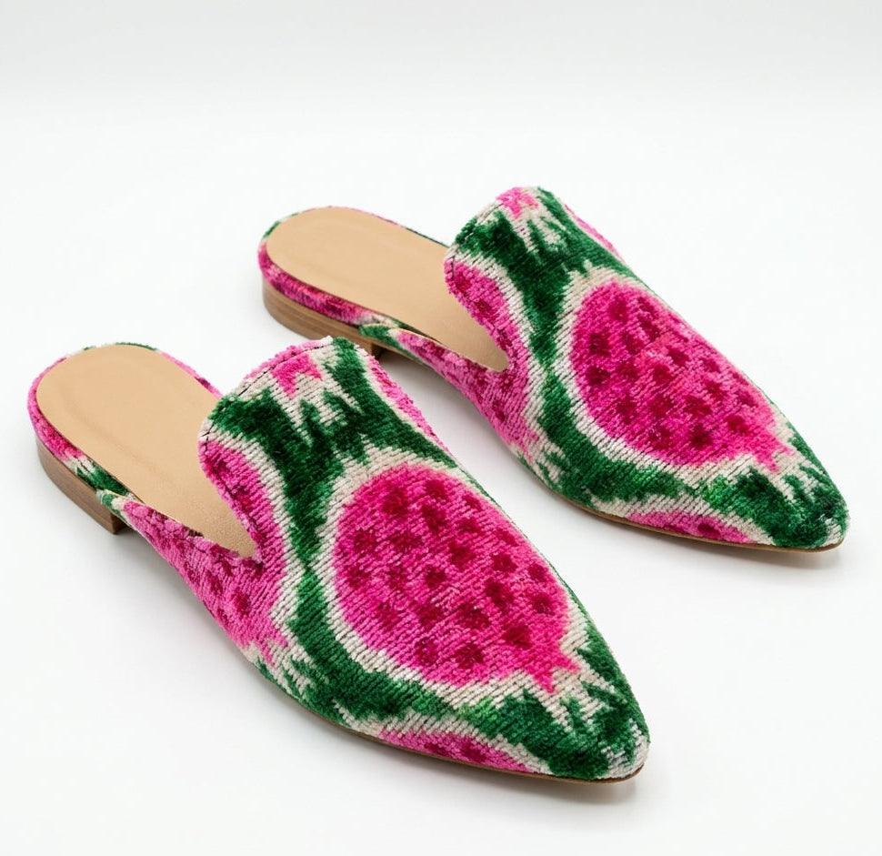 Pair of slippers with watermelon pattern on a white background
