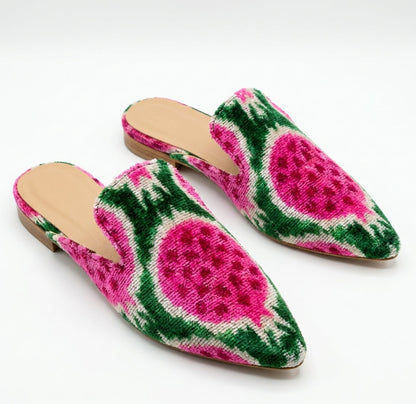 Pair of slippers with watermelon pattern on a white background
