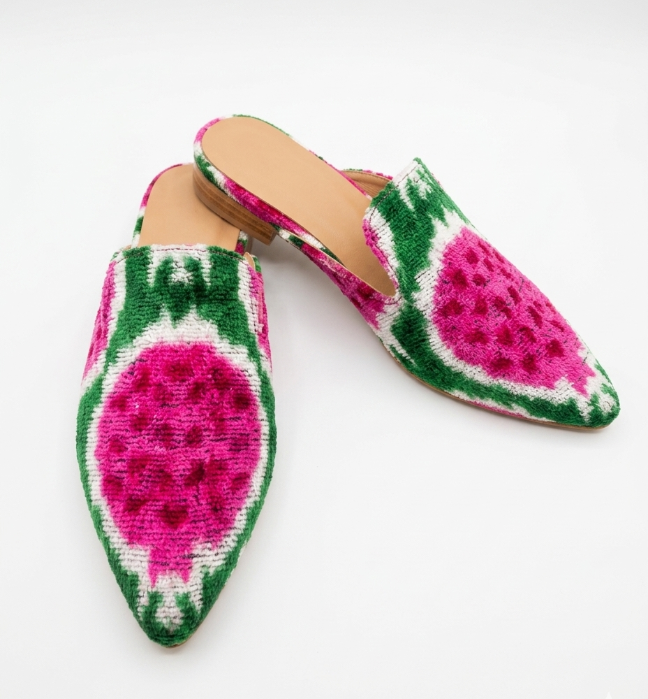 Pair of slippers with watermelon pattern on a white background