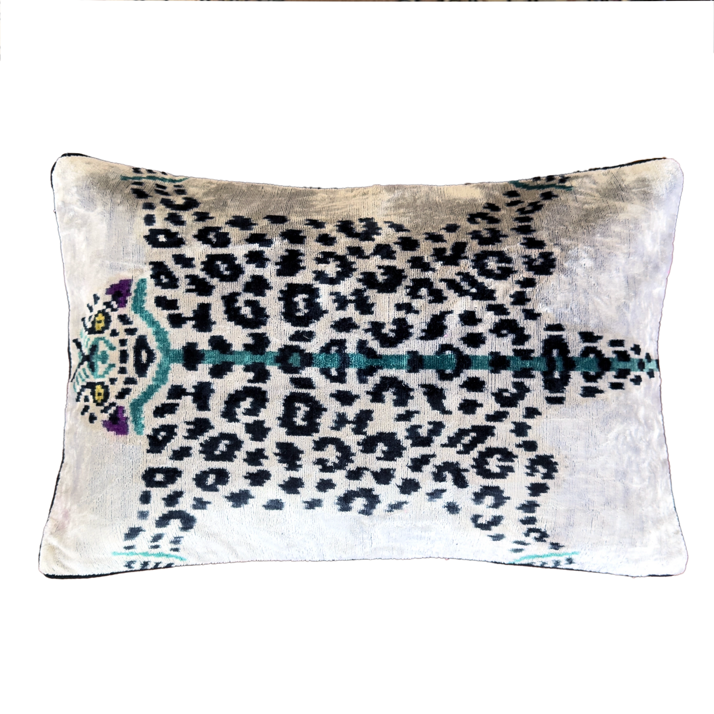 Handmade Royal Snow Leopard silk velvet ikat cushion cover featuring black rosette spots with turquoise, purple and golden accents on an ivory background, 40×60 cm.