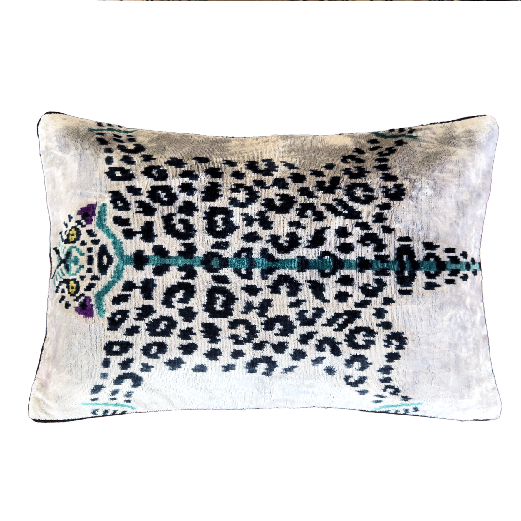 Handmade Royal Snow Leopard silk velvet ikat cushion cover featuring black rosette spots with turquoise, purple and golden accents on an ivory background, 40×60 cm.