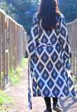 Get ready for Black Friday with our exquisite handwoven silk ikat caftan, a perfect ikat dress for gifting. Crafted using traditional Uzbekistan ikat woven techniques, this stunning ikat wear features bell sleeves, side and sleeve slits, and pockets on both sides. Available in elegant black and grey, this ikat caftan beautifully blends bohemian style with ethnic charm, making it the ideal gift for anyone who appreciates unique ikat fashion. Embrace the artistry of handmade ikat clothing and make a statement