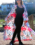 Silk ikat kimono caftan is a perfect blend of handmade artistry and traditional craftsmanship, showcasing the beauty of handwoven fabrics. This elegant piece features intricate ikat patterns, embodying the essence of boho style and ethnic fashion. Made from luxurious silk, the silk ikat kimono offers both comfort and sophistication, making it suitable for various occasions. Whether you're dressing up for a special event or looking for a stylish addition to your everyday wardrobe, this ikat caftan is the ide