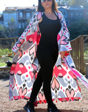 Silk ikat kimono caftan is a perfect blend of handmade artistry and traditional craftsmanship, showcasing the beauty of handwoven fabrics. This elegant piece features intricate ikat patterns, embodying the essence of boho style and ethnic fashion. Made from luxurious silk, the silk ikat kimono offers both comfort and sophistication, making it suitable for various occasions. Whether you're dressing up for a special event or looking for a stylish addition to your everyday wardrobe, this ikat caftan is the ide