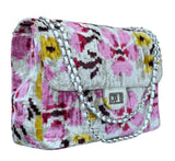 Floral patterned silk velvet ikat jumbo coco bag with a chain strap on a white background