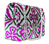 Silk velvet ikat jumbo coco bag pink and green color. Patterned handbag with a chain strap on a white background