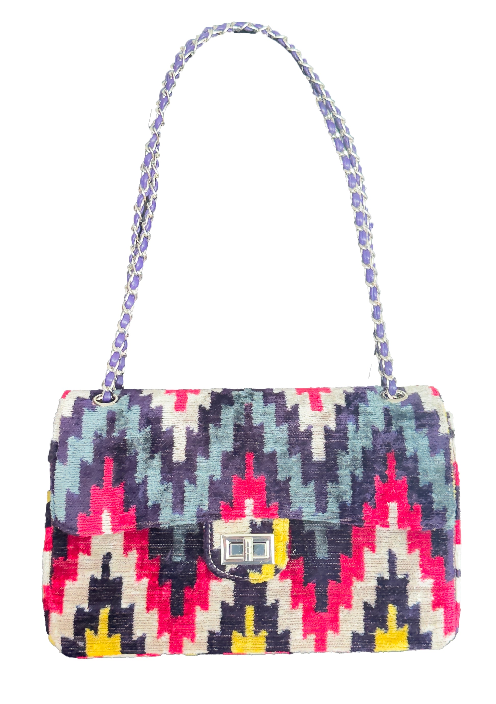 Multicolored patterned handbag with a strap on a white background