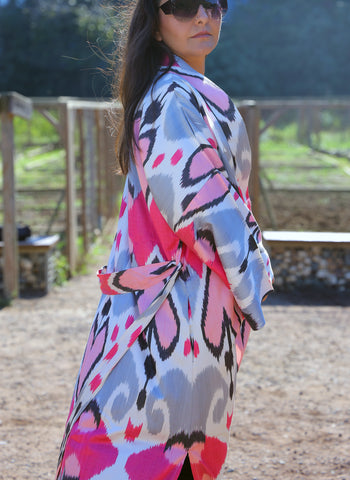 Silk ikat kimono caftan is a perfect blend of handmade artistry and traditional craftsmanship, showcasing the beauty of handwoven fabrics. This elegant piece features intricate ikat patterns, embodying the essence of boho style and ethnic fashion. Made from luxurious silk, the silk ikat kimono offers both comfort and sophistication, making it suitable for various occasions. Whether you're dressing up for a special event or looking for a stylish addition to your everyday wardrobe, this ikat caftan is the ide