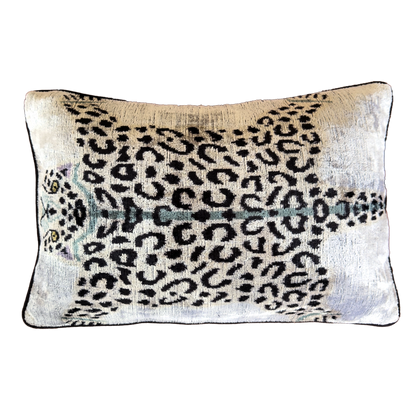 Handmade Royal Snow Leopard silk velvet ikat cushion cover featuring black rosette spots with turquoise, purple and golden accents on an ivory background, 40×60 cm.