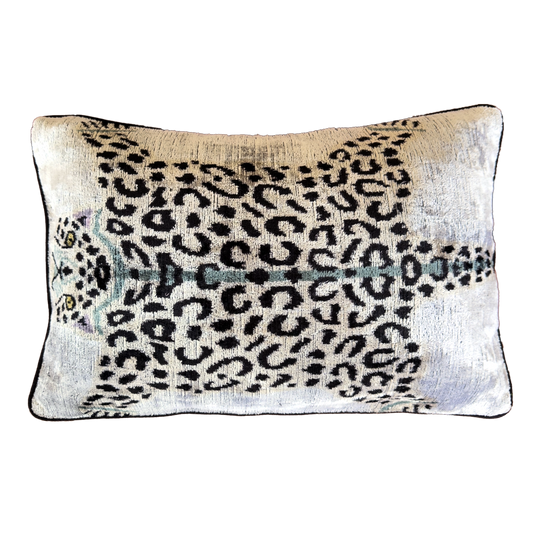 Handmade Royal Snow Leopard silk velvet ikat cushion cover featuring black rosette spots with turquoise, purple and golden accents on an ivory background, 40×60 cm.