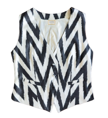 Black and white zigzag patterned silk ikat vest on a white background