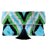 Wholesale designer handbags and green and turquaz clutch bags supplier, offering Silk Velvet Ikat handmade clutch bags with a stylish chain shoulder strap included. 