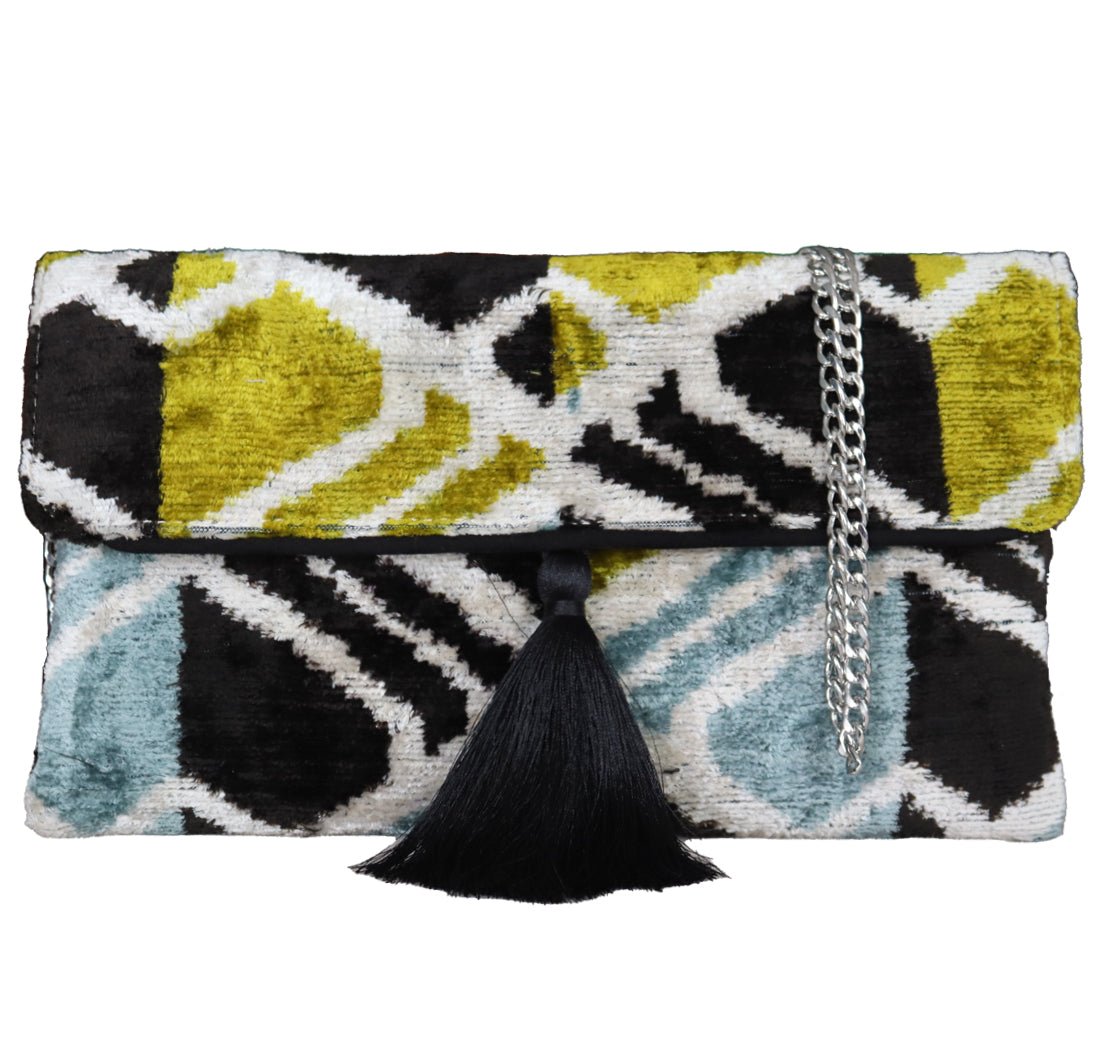 Silk velvet ikat handmade clutch bags, featuring a stylish chain shoulder strap included. Explore our exclusive collection, expertly handcrafted by skilled artisans in Istanbul's Grand Bazaar, Turkey, using traditional Uzbek fabrics. Specially crafted with handwoven silk velvet ikat, each piece showcases vibrant colors and ethnic patterns, accented by special handmade details. Perfect for ethical fashion enthusiasts and holiday shopping, including Valentine's Day gifts, Black Friday sales, discounts, and Mo