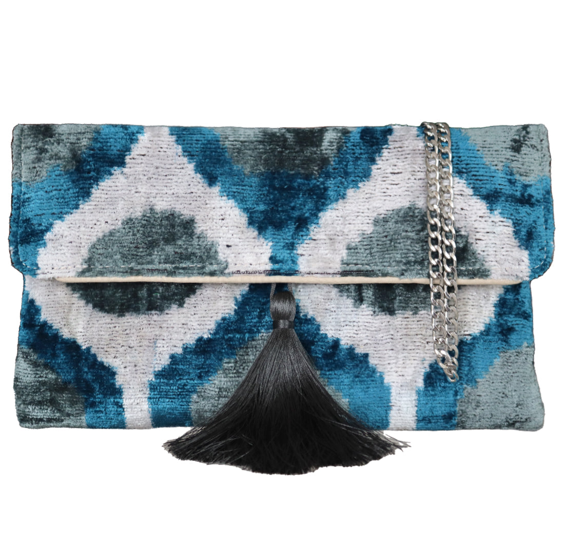 Wholesale and retail Silk İkat Velvet Clutch Bags, expertly handcrafted using traditional Uzbek fabrics. Explore our exclusive collection of unique clutch bags, specially crafted using handwoven silk velvet ikat with vibrant colors and ethnic patterns. Each one carries its own uniqueness, accentuated by special handmade details. Produced by skilled artisans in Istanbul's Grand Bazaar, Turkey, these bags are perfect for ethical fashion enthusiasts and holiday shopping, including Valentine's Day gift, Black F
