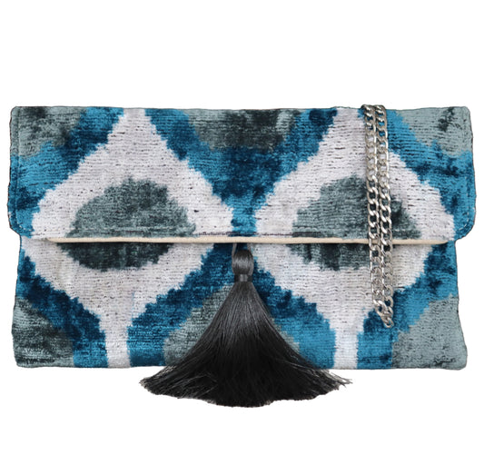 Wholesale and retail Silk İkat Velvet Clutch Bags, expertly handcrafted using traditional Uzbek fabrics. Explore our exclusive collection of unique clutch bags, specially crafted using handwoven silk velvet ikat with vibrant colors and ethnic patterns. Each one carries its own uniqueness, accentuated by special handmade details. Produced by skilled artisans in Istanbul's Grand Bazaar, Turkey, these bags are perfect for ethical fashion enthusiasts and holiday shopping, including Valentine's Day gift, Black F