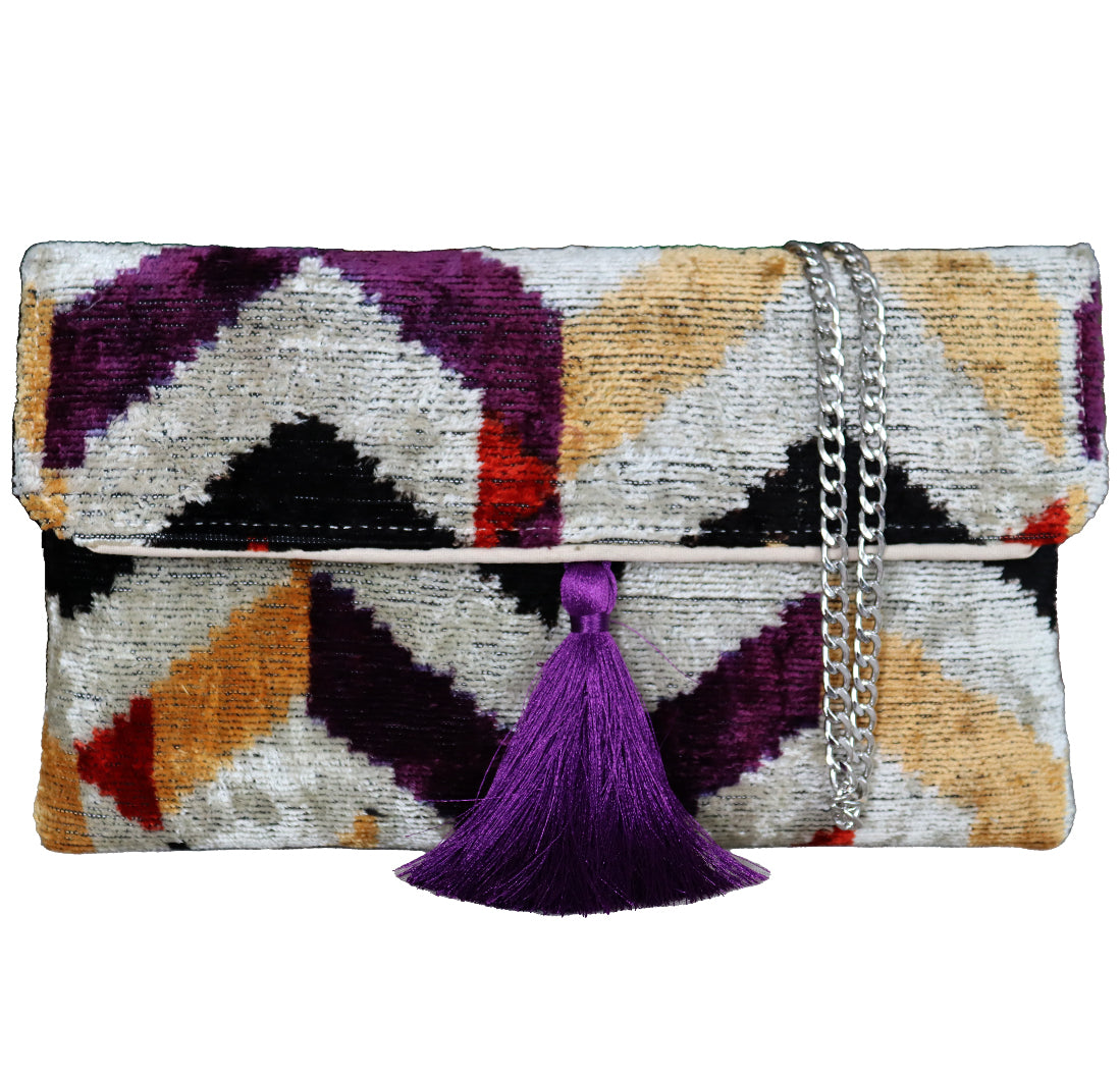 Wholesale and retail Silk İkat Velvet Clutch Bags, expertly handcrafted using traditional handmade Uzbek fabrics. Explore our exclusive collection of unique clutch bags, specially crafted using handwoven silk velvet ikat with vibrant colors and ethnic patterns. Each one carries its own uniqueness, accentuated by special handmade details. Perfect for ethical fashion enthusiasts and holiday shopping, including Valentine's Day gift, Black Friday sale, and Mother's Day gift, these artisanal silk velvet bags off