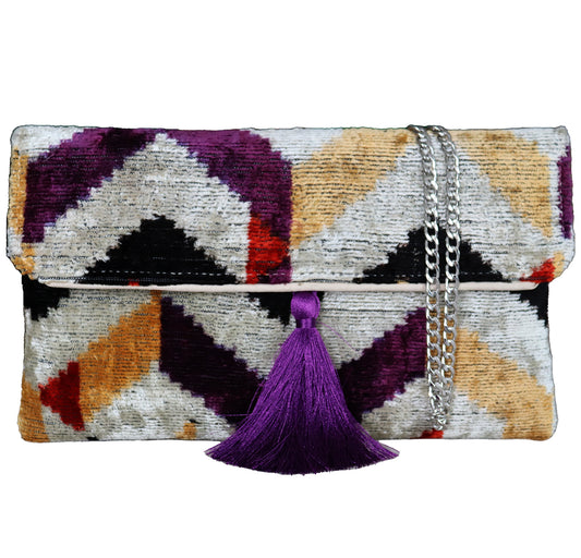Wholesale and retail Silk İkat Velvet Clutch Bags, expertly handcrafted using traditional handmade Uzbek fabrics. Explore our exclusive collection of unique clutch bags, specially crafted using handwoven silk velvet ikat with vibrant colors and ethnic patterns. Each one carries its own uniqueness, accentuated by special handmade details. Perfect for ethical fashion enthusiasts and holiday shopping, including Valentine's Day gift, Black Friday sale, and Mother's Day gift, these artisanal silk velvet bags off