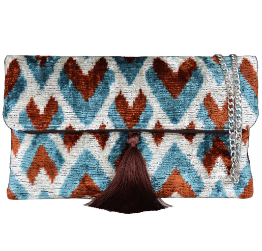 Explore our collection of Silk İkat Clutch Bags and Velvet İkat Handbags, expertly handcrafted using traditional Uzbek fabrics.