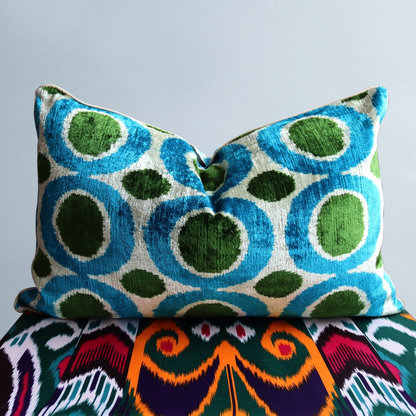 silk ikat handwoven velvet cushion cover in vibrant colors blue and green  ideal for luxury style decor.