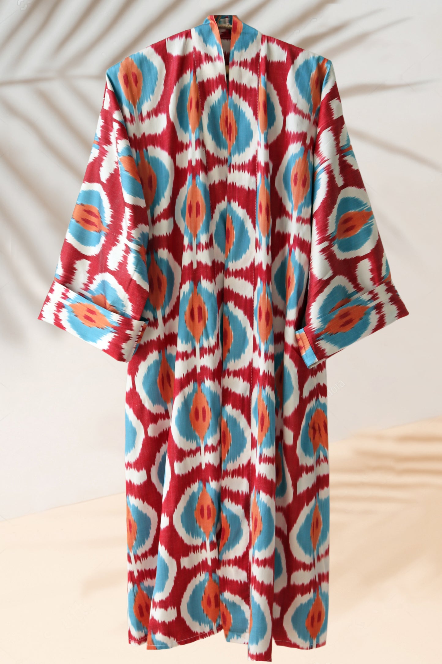 Handwoven silk ikat orange, red, blue kimono style caftan dress.