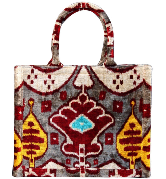 Shop Colorful and Luxurious Tote Bags for Women
Step into a world of vibrant fashion with our collection of luxury tote bags that combine elegance and functionality. Our colorful tote bags feature intricate ikat textile designs, adding a unique cultural flair to your wardrobe. From bold and vibrant velvet totes to timeless canvas tote bags, each piece is meticulously crafted to provide a statement look for any occasion.