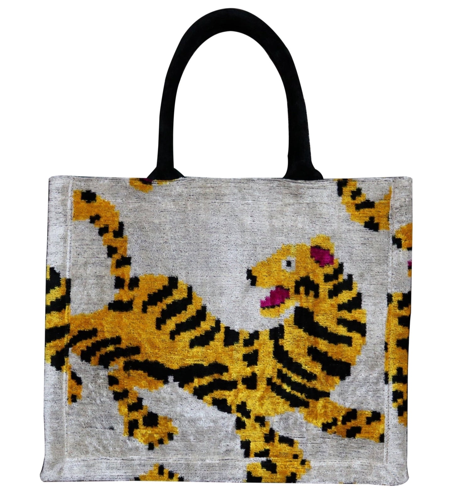 Shop Colorful and Luxurious Tote Bags for Women
Step into a world of vibrant fashion with our collection of luxury tote bags that combine elegance and functionality. Our colorful tote bags feature intricate ikat textile designs, adding a unique cultural flair to your wardrobe. From bold and vibrant velvet totes to timeless canvas tote bags, each piece is meticulously crafted to provide a statement look for any occasion. Tiger patern.